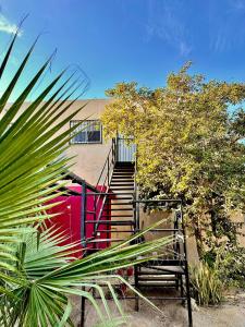 a set of stairs leading up to a building at Departamento grande y centrico, con 3 recámaras y 2 baños completos. in Cabo San Lucas