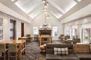 a living room with furniture and a fireplace at Residence Inn Mobile in Mobile