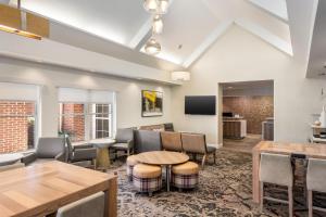 a living room with a table and chairs at Residence Inn Mobile in Mobile