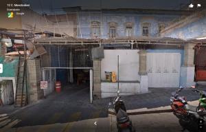 a building that is under construction with motorcycles parked in front at El Rinc&oacute;n de Cervantes Secret House by Lunian in Guanajuato