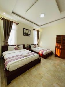 Voodi või voodid majutusasutuse Hoang Quan Hotel toas