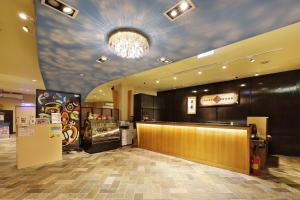 a fast food restaurant with a ceiling with a mural of clouds at Shante Hotel Shitou in Lugu Lake