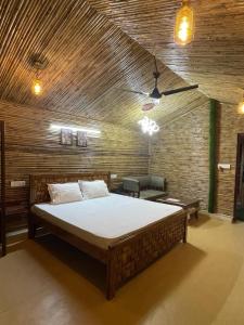 a bedroom with a large bed in a room at Gopika Resort in Vrindāvan