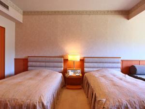 Ліжко або ліжка в номері Hotel Miki