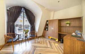 a dining room with a table and a window at TALA Dalat Hotel in Da Lat +30 photos