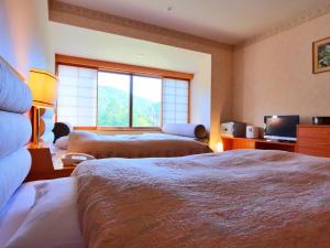 Ліжко або ліжка в номері Hotel Miki