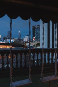 a view of a city skyline from a balcony at The Hammock Hotel Ben Thanh in Ho Chi Minh City