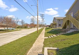 an empty street next to a house at Downtown Med District: Stylish & Modern 2BD, 1BA Capital City Escape! in Springfield