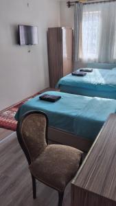 A bed or beds in a room at Emre's Stone House