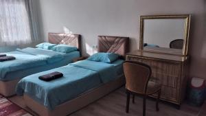 A bed or beds in a room at Emre's Stone House