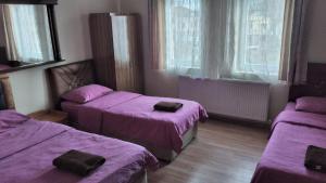 A bed or beds in a room at Emre's Stone House