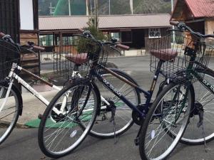 a couple of bikes parked next to each other at 民宿みやま in Ōno