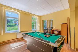 a living room with a pool table in it at Denkhaus Loccum in Rehburg-Loccum