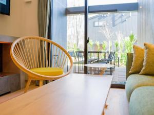 a living room with a couch and a chair at Rakuten STAY VILLA Nasu Villa Capacity of 10 persons with Kitchen Tools Type No pet allowed in Nasu-yumoto