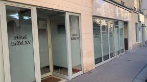 a row of glass doors on a building at Hôtel Eiffel XV in Paris