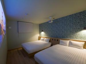 En eller flere senger på et rom på Rakuten STAY VILLA Nasu with open-air Jacuzzi Room Capacity of 8 persons