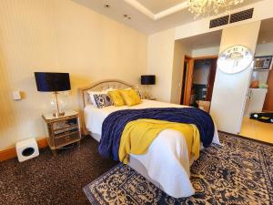 a bedroom with a bed and a clock on the wall at Deluxe Private Apartment and Studio - Ocean Views in Gold Coast