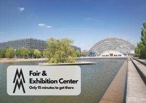 a sign that reads fair and exhibition center with a pond at Design City Apt Daisy - Modern, Zentral, Kaffeebar in Leipzig