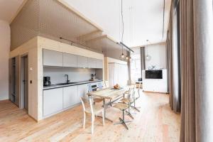 a kitchen and dining room with a table and chairs at NaturparkResort Alte Schule in Hieflau