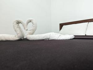 Postel nebo postele na pokoji v ubytování Big John Hotel