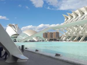 a white bridge over a pool in front of a building at Barraca Breeze in Valencia