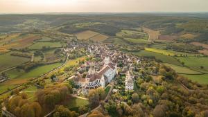 an aerial view of a town in the middle of a field at Le gîte du Sorcier 89 in Avallon