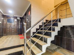 a stairwell in a building with a stair case at Super Collection O Chepauk Near MA Chidambram Stadium in Chennai