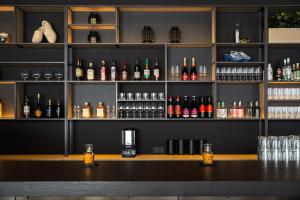 a bar with a lot of bottles of alcohol at IntercityHotel Leiden in Leiden