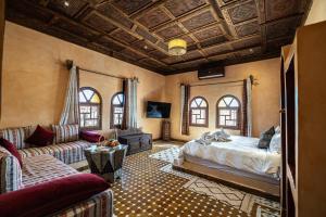 Postel nebo postele na pokoji v ubytování Hotel Riad Xaluca