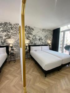 Postel nebo postele na pokoji v ubytování Oriente Atiram Hotel + 32 fotografií
