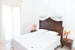 Postel nebo postele na pokoji v ubytování apartment irini
