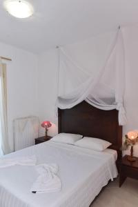 Postel nebo postele na pokoji v ubytování apartment irini
