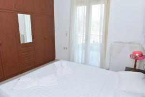 Postel nebo postele na pokoji v ubytování apartment irini