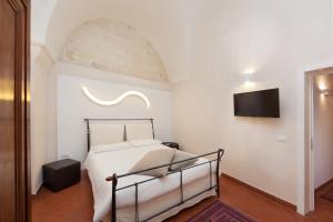 Postel nebo postele na pokoji v ubytování B&B Corte Dei Taralli