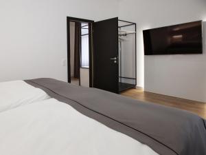 Postel nebo postele na pokoji v ubytování DORMERO Hotel Worms