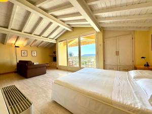 a bedroom with a large bed and a large window at Agriturismo Monteverde in Castelnuovo Magra +116 photos