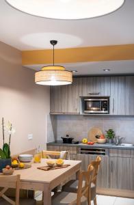 Kuchyň nebo kuchyňský kout v ubytování Résidence Pierre & Vacances Premium Julia Augusta