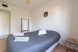 Ένα ή περισσότερα κρεβάτια σε δωμάτιο στο Malibu, Chaleureuse Maison