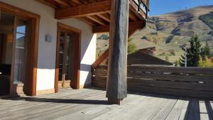 a porch of a house with a view of a mountain at Cortina - 11 - Appart grande terrasse - 8 pers in Les Deux Alpes