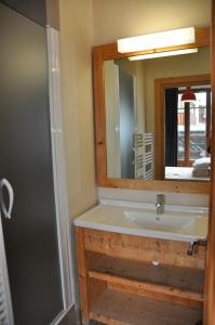 a bathroom with a sink and a mirror at Cortina - 12 - Appart confort - 8 pers in Les Deux Alpes