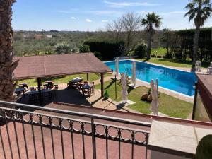 a view of a swimming pool from a balcony at Agriturismo Villa Pina in Lizzanello