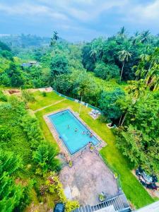 an overhead view of a swimming pool in a park at Hanthana SK Paradise in Gampola