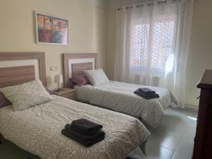 Postel nebo postele na pokoji v ubytování Apartamento Portbou