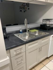 a kitchen with a sink and a counter top at Blessing Home IN in Indianapolis