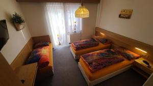 Postel nebo postele na pokoji v ubytování Hotel Garni Ongaro