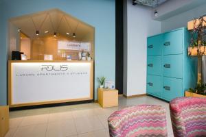 a store with two chairs in front of a counter at Polis Apartments in Thessaloniki