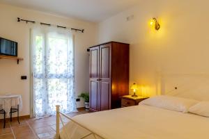 Posteľ alebo postele v izbe v ubytovaní A casa dù Rumanu - Taormina