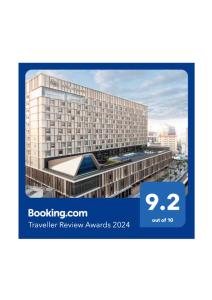 een foto van een gebouw met de woorden Booking com Traveller Review Awards bij Hotel Collective in Naha