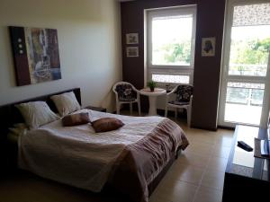 Posteľ alebo postele v izbe v ubytovaní Apartamenty Diva Kołobrzeg