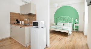 Kuchyň nebo kuchyňský kout v ubytování Ombra i Sol apartments